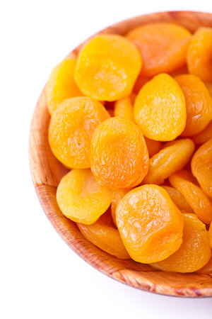ied apricots on a white background