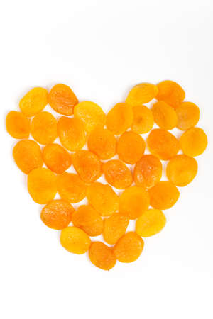 Dried apricots in shape of heartの写真素材