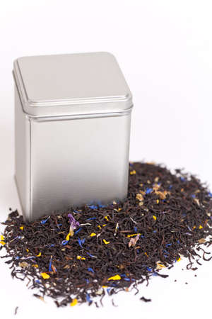 Silver tea box with green fruit teaの写真素材