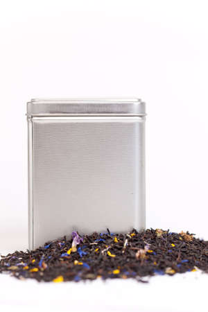 Silver tea box with green fruit teaの写真素材