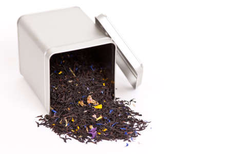 Tea spilling out of a tea boxの写真素材