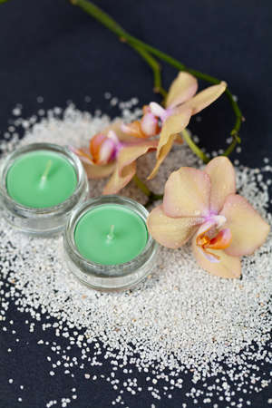 Sand, Orchid flower and Candleの写真素材