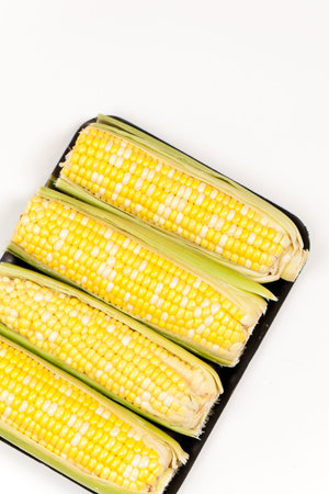 Yellow sweet corn on tray
