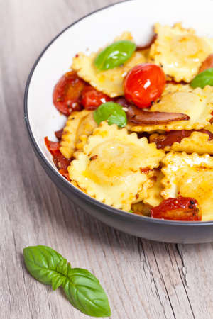 Ravioli with ricotta, tomatoes and basilの写真素材