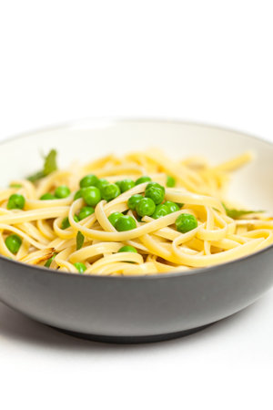 Close up of fresh pasta with peas and mint leavesの写真素材