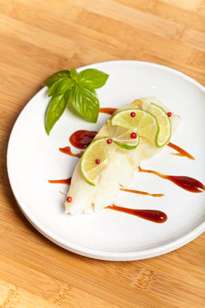 Dinner Plate with White Fish の写真素材