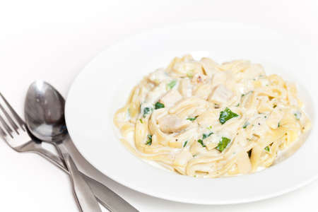 Chicken creamy alfredo sauce with white meat chicken, spinach   fettuccine pastaの写真素材