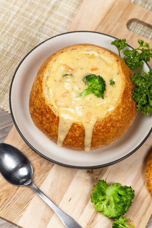 Sourdough bread bowl filled with broccoli cheese soup