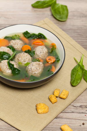 Spinach and Chicken meatball soupの写真素材