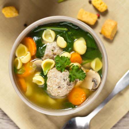 Spinach and Chicken meatball soupの写真素材