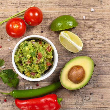 Guacamole with avocado, lime, tomato and cilantro Guacamole with avocado, lime, tomato and cilantro
