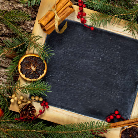Holiday Decorations. Christmas composition with chalkboard. Selective focus.の写真素材