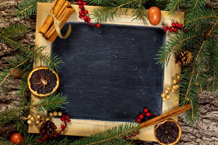 Holiday Decorations. Christmas composition with chalkboard. Selective focus.