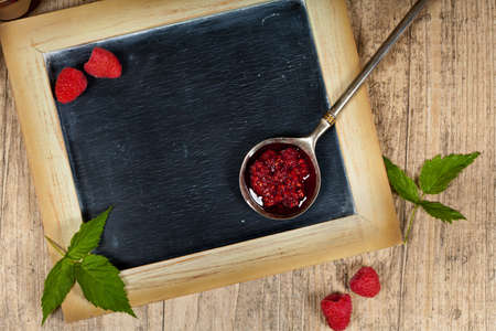 Raspberries Jam with Chalkboard. Selective focus.の写真素材