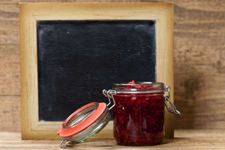 Fresh Raspberries Jam with Chalkboard. Selective focus.の写真素材