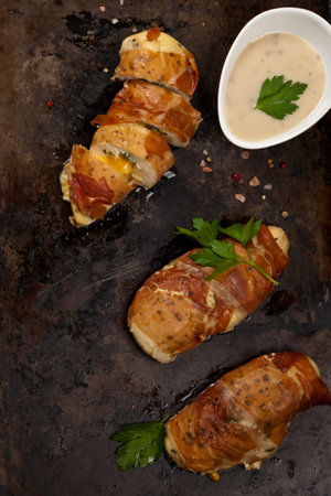 Prosciutto Wrapped Chicken breast. Selective focus.