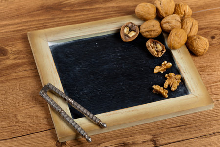 Walnuts with chalkboard. Selective focus.