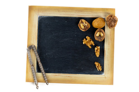 Walnuts with chalkboard. Selective focus.