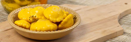 Pickled Yellow Pattypan Squash. Selective focus.の写真素材