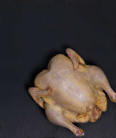 Whole Raw Chicken ready to cook. Selective focus.の写真素材