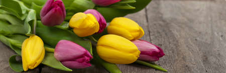 Bouquet of Tulips on wood table. Selective focus.の写真素材