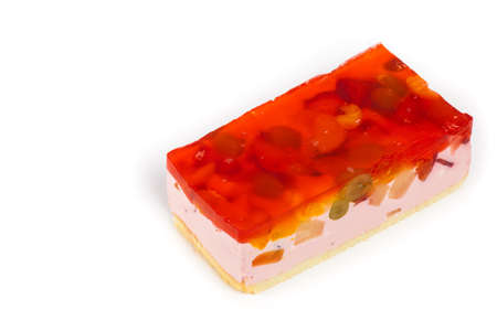 Fruit yogurt cheesecake with jelly on white background. Selective focus.の写真素材