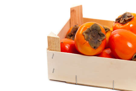 Orange Persimmons on white background. Selective focus.の写真素材