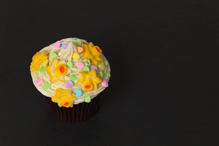 Gourmet Spring Easter Cupcakes on a black background. Selective focus.