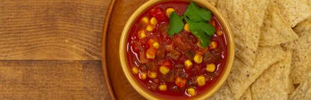 Chunky Salsa with Corn. Panoramic image. Selective focus.の写真素材