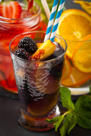Peach and Blackberry Refreshing Summer Drinks. Selective focus.