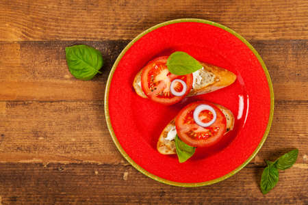 Sandwich with Tomato and Cream Cheese and Basil . Selective focus.の写真素材
