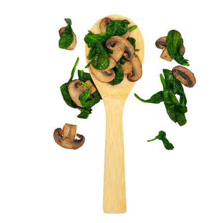 Sauteed Spinach and Mushrooms isolated on white. Selective focus.の写真素材