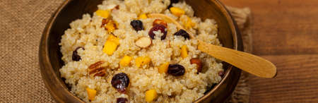 Quinoa Porridge with Pumpkin, Nuts and Dried Fruit. Selective focus.の写真素材