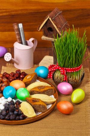 Colored eggs, wheat springs Nowruz Holiday in Azerbaijan. Selective focus.