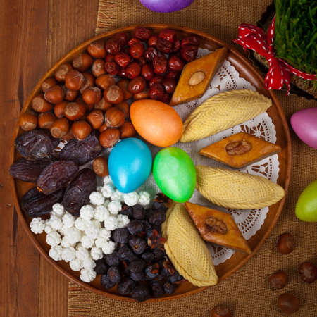 Colored eggs, wheat springs Nowruz Holiday in Azerbaijan. Selective focus.の写真素材