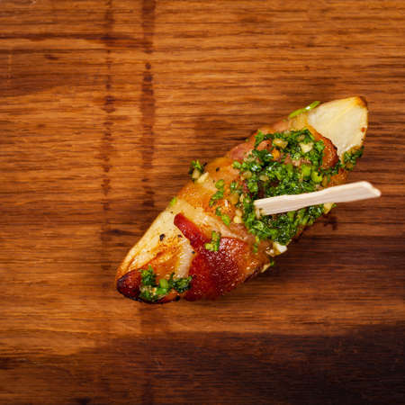 Bacon Wrapped Potatoes with Parsley Garlic Pesto Sauce. Selective focus.の写真素材