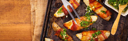 Bacon Wrapped Potatoes with Parsley Garlic Pesto Sauce. Selective focus.の写真素材