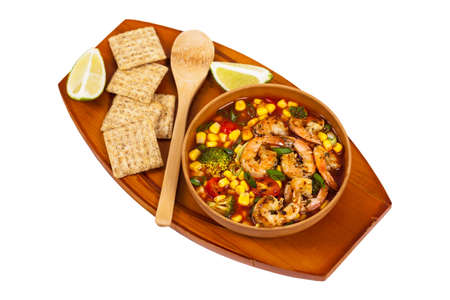 Shrimp Soup With Tomato, Broccoli and Corn Isolated on White background. Selective focus.の写真素材