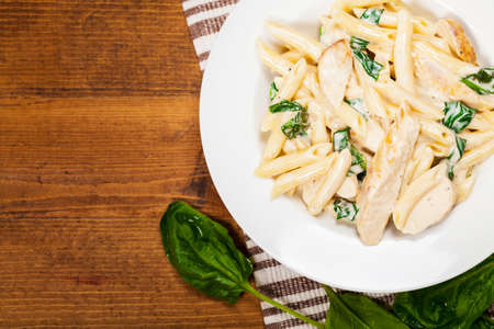 Chicken Alfredo Pasta with Spinach. Selective focus.の写真素材
