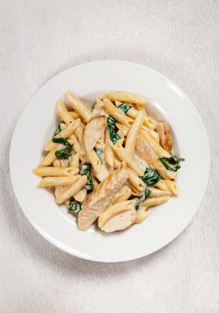 Chicken Alfredo Pasta with Spinach. Selective focus.の写真素材