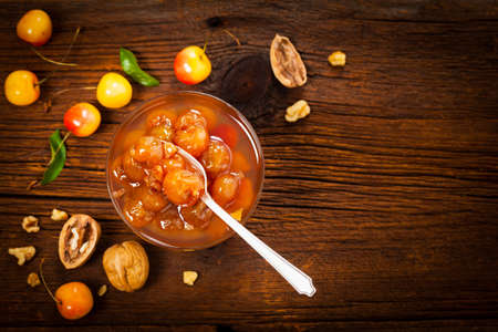 Cherry Jam with Nuts. Azerbaijani Cuisine White Cherry Preserves. Selective focus.の写真素材