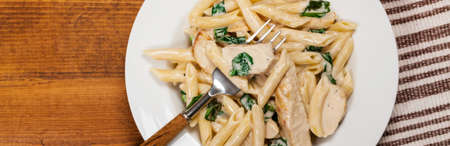 Chicken alfredo spinach parmesan pasta. Selective focus.の写真素材
