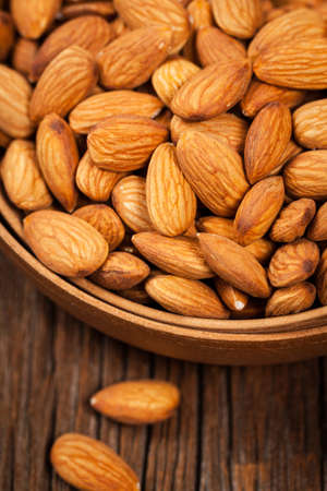 Almonds Nuts in the Bowl Background. Selective focus.の写真素材