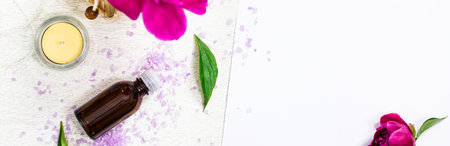 Top view of Spa Theme Objects with Purple Peony Rose Bath Salt Panoramic image. Selective focus.