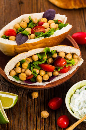 Veggie Pitas with Garbanzo Bean or Chickpea Salad. Selective focus.の写真素材