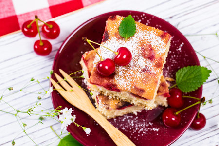 Tart Cherry Cake with Powdered Sugar. Selective focus.