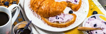 Continental Breakfast with Croissants and Blueberry Cream Cheese Spread. Selective focus.の写真素材