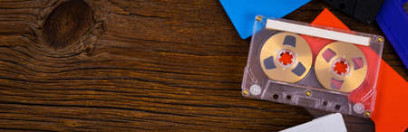 Compact Audio Cassette Tape on Wooden Background Panoramic image. Selective focus.の写真素材