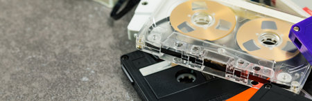 Vintage Reel to Reel Compact Audio Cassette Tape Panoramic image. Selective focus.