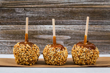 Caramel Apples on Wooden Background. Selective focus.の写真素材